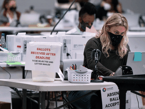 Election workers check in provisional ballots on November 7, 2020 in Lawrenceville, Georgia.