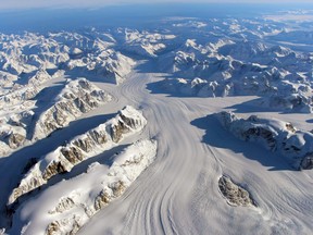 This file photo taken on October 13, 2015 and obtained on November 24, 2015 by NASA shows the Heimdal Glacier in southern Greenland, captured from NASA Langley Research Center's Falcon 20 aircraft flying 33,000 feet above mean sea level during NASAs Operation IceBridge, an airborne survey of polar ice.