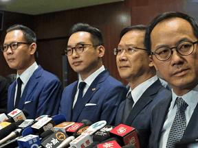 Expelled Hong Kong lawmakers, from left, former Canadian citizens Dennis Kwok and Alvin Yeung, with Kwok Ka-ki and Kenneth Leung during a press conference at Legislative Council in Hong Kong, Wednesday, Nov. 11, 2020.