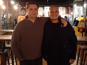 Columnist Jamil Jivani, right, poses for a photo with J.D. Vance, his best friend from law school, in Cincinnati in October 2019. Vance's book Hillbilly Elegy has been made into a Ron Howard movie for Netflix starring Glenn Close and Amy Adams.