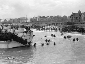 Canadian landing craft 299 delivers troops to Juno Beach, Courseilles-sur-Mer, France, on June 6, 1944.