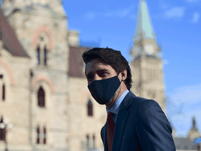 Prime Minister Justin Trudeau heads to a press conference to provide an update on the COVID pandemic, in Ottawa on Friday, Nov. 13, 2020.