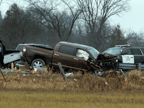 Investigators examine the scene of a fatal shooting in Kawartha Lakes, Ont., Friday, Nov. 27, 2020. Ontario's police watchdog agency says they are probing an incident in which a child was shot dead and two others, including an officer, injured.