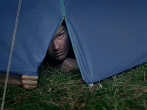 Roughing it: Leif Edlund peers out of his tent in Koko-di Koko-da.