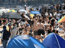 People enjoy the warm weather on Melbourne's St Kilda Beach on November 3, 2020, as Australia's Victoria state records its fourth straight day of zero COVID-19 transmissions after battling a second wave of infections.