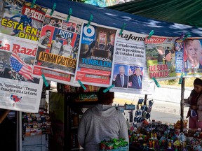 Newspapers are displayed at a kiosk in Mexico City on Nov. 4, 2020, a day after the U.S. presidential election.