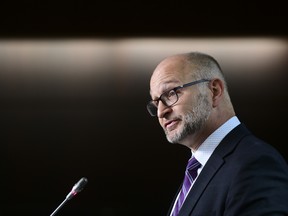 Justice Minister David Lametti hold a press conference on Parliament Hill in Ottawa on Oct. 1.