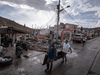 Local villagers work on rebuilding their homes on November 23, 2020 in Providencia Island, Colombia, after it was hit by Hurricane Iota.