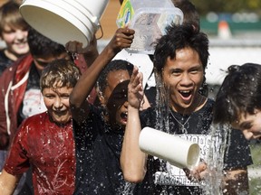 Students at Westminster School participate in an ALS Ice Bucket Challenge at their school in Edmonton, Alta., on Friday, Sept. 19, 2014.