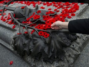 A poppy is placed on the Tomb of The Unknown Soldier following a Remembrance Day ceremony at the National War Memorial in Ottawa, Monday, Nov. 11, 2019.