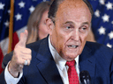 Donald Trump's personal lawyer Rudy Giuliani perspires as he speaks during a press conference at the Republican National Committee headquarters in Washington, DC, on November 19, 2020.