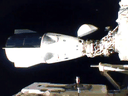 NASA's SpaceX Crew-1 mission aboard the SpaceX Crew Dragon, left, docks at the International Space Station on November 16, 2020.