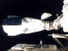 NASA’s SpaceX Crew-1 mission aboard the SpaceX Crew Dragon, left, docks at the International Space Station on November 16, 2020.