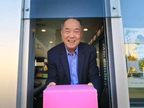 Cheaper by the dozen? Ted Ngoy displays his cost-saving pink box in The Donut King.