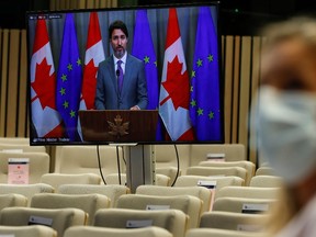 Prime Minister of Canada Justin Trudeau on a screen speaks during a joint press conference with European Council President following a virtual EU - Canada Summit in Brussels, on October 29, 2020. PHOTO BY OLIVIER HOSLET/POOL/AFP via Getty Images.