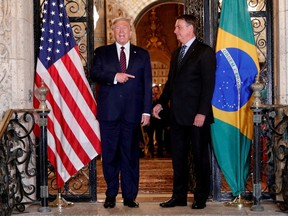 U.S. President Donald Trump hosts a photo-op with Brazilian President Jair Bolsonaro before attending a working dinner at the Mar-a-Lago resort in Palm Beach, Florida, U.S., March 7, 2020. PHOTO BY TOM BRENNER/REUTERS/File Photo ORG.