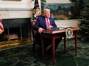 U.S. President Donald Trump arrives to a Thanksgiving video teleconference with members of the military forces at the White House in Washington, U.S., November 26, 2020.