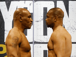 Mike Tyson, left, and Roy Jones, Jr. face off during weigh ins for a heavyweight exhibition boxing bout for the WBC Frontline Belt in Los Angeles, November 27, 2020.