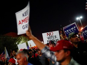 Supporters of U.S. President Donald Trump gather in front of the Maricopa County Tabulation and Election Center (MCTEC) to protest about the early results of the 2020 presidential election, in Phoenix, Arizona November 4, 2020.