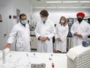 Prime Minister Justin Trudeau with Economic Development Minister Melanie Joly and Innovation, Science and Industry Minister Navdeep Bains speak about COVID-19 vaccines during a visit to the National Research Council facility in Montreal, August 31, 2020.