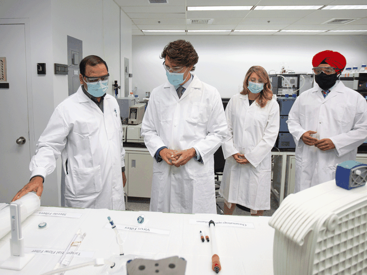  Prime Minister Justin Trudeau with Economic Development Minister Melanie Joly and Innovation, Science and Industry Minister Navdeep Bains speak about COVID-19 vaccines during a visit to the National Research Council facility in Montreal, August 31, 2020.