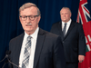 Ontario Premier Doug Ford listens as Chief Medical Officer of Health Dr. David WIlliams speaks during the daily briefing at Queen’s Park in May.