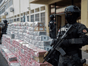 Members of National Drug Control Directorate guard over 1,747 kg of cocaine in Santo Domingo, Colombia, on November 1, 2020.
