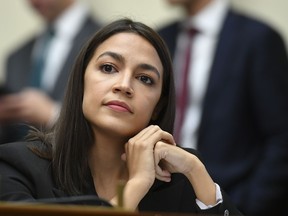 Rep. Alexandria Ocasio-Cortez(D-NY) listens as Facebook Chairman and CEO Mark Zuckerberg testifies before the House Financial Services Committee on "An Examination of Facebook and Its Impact on the Financial Services and Housing Sectors" in the Rayburn House Office Building in Washington, DC on October 23, 2019.