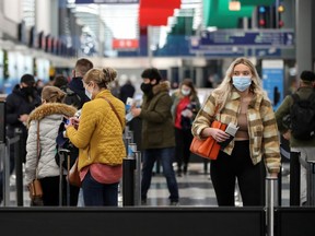 Travelers arrive at O'Hare International Airport ahead of the Thanksgiving holiday during the coronavirus disease (COVID-19) pandemic, in Chicago, Illinois, U.S. November 25, 2020.