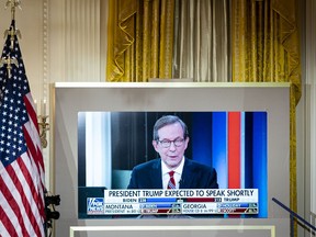 Chris Wallace, Fox News anchor, is displayed on a monitor during an election night party in the East Room of the White House in Washington, D.C., U.S., on Wednesday, Nov. 4, 2020.