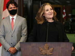 (FILES) In this file photo taken on August 18, 2020, Canadian Finance Minister Chrystia Freeland (R) speaks during a news conference on Parliament Hill in Ottawa, as Prime Minister Justin Trudeau looks.
