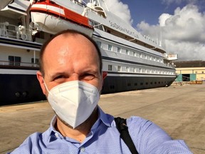 Gene Sloan, a senior reporter on cruise and travel for the Points Guy, takes a photo in front of SeaDream, the first cruise ship to go on a Caribbean cruise since March.