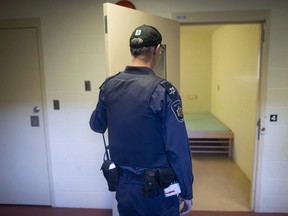 A corrections officer opens the door to a cell in the segregation unit at the federal Fraser Valley Institution for Women during a media tour, in Abbotsford, B.C., Thursday, Oct. 26, 2017. Independent reviews of the hundreds of inmates placed in segregation over the past year found only a handful were inappropriate, new government data indicate.