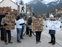 An anti-mask demonstration in Canmore, Alta., on Sunday, November 29, 2020. Ethicists disagree on whether people who flout public health measures should accept prompt care should they contract the virus.