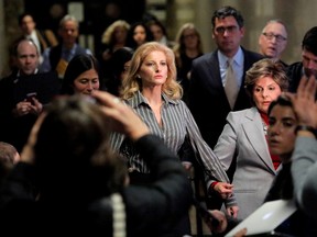 Summer Zervos, a former contestant on The Apprentice, leaves New York State Supreme Court with attorney Gloria Allred (R) after a hearing on the defamation case against U.S. President Donald Trump in Manhattan, New York City, U.S., December 5, 2017.