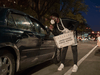 An election worker talks with someone dropping of an absentee ballot outside the Department of Elections on November 3, 2020 in Detroit, Michigan.