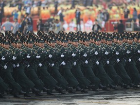 Soldiers of the People's Liberation Army march through Tiananmen Square in Beijing in 2019.