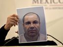 Mexico's Attorney General Arely Gomez shows a picture of Mexican drug kingpin Joaquin