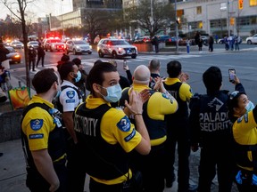 Hospital workers applaud as Toronto first responders parade down hospital row in Toronto, Ontario, Canada, in a salute to healthcare workers on April 19, 2020.