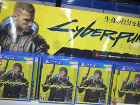 Copies of the Cyberpunk 2077 game for the Sony Playstation is seen on display in the gaming section of a shop in Tokyo on December 18, 2020, as Sony announced the pulling of the much-hyped game from PlayStation stores around the world after a flood of complaints and ridicule over bugs, compatibility issues and even health risks.