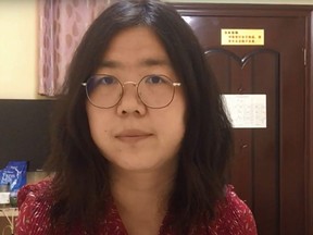 This screengrab taken on December 28, 2020 from an undated video showing former Chinese lawyer and citizen journalist Zhang Zhan as she broadcasts via YouTube, at an unconfirmed location in China.