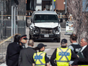The van driven by Alek Minassian in a deadly rampage sits on a sidewalk in Toronto on Monday, April 24, 2018.