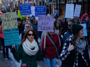 Hundreds of anti-mask protesters march in Calgary on Nov. 21, 2020.