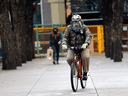 A man rides his bike on an near empty Stephen Avenue mall in Calgary as new COVID restrictions were announced on Wednesday, December 9, 2020. The COVID-19 numbers in Alberta are among the worst in the country, depending on which metric one uses.