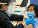 Personal support worker Anita Quidangen becomes the first person in Ontario to receive the Pfizer/BioNTEch COVID-19 vaccine, in Toronto, on Dec. 14.