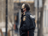 Winnipeg police chief Danny Smyth wears a mask while walking through the city’s downtown area on  Thursday, December 10, 2020.