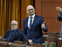 Justice Minister David Lametti rises to vote in favour of a motion on Bill C-7, regarding medical assistance in dying, in the House of Commons on Thursday, Dec. 10, 2020.