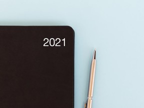 2021 diary and pen on blue backgrounds - new year concept