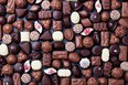 Assortment of fine chocolate candies, white, dark, and milk chocolate Sweets background Copy space Top view