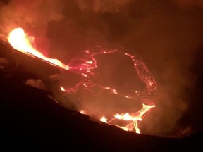 Lava erupts from Kilauea volcano in Hawaii, U.S. December 21, 2020 in this still image taken from social media video.